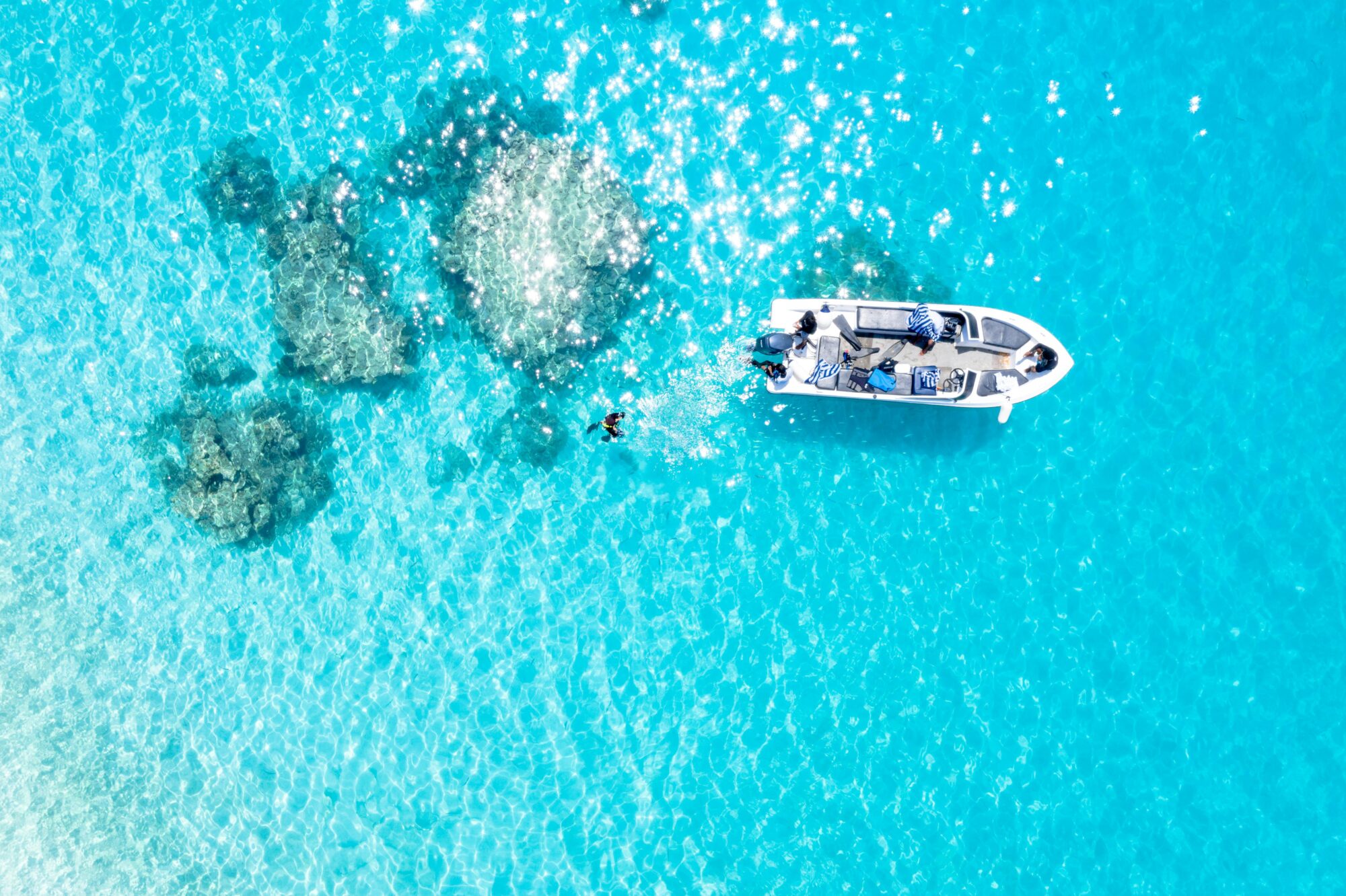 A Boat on Blue Body of Water